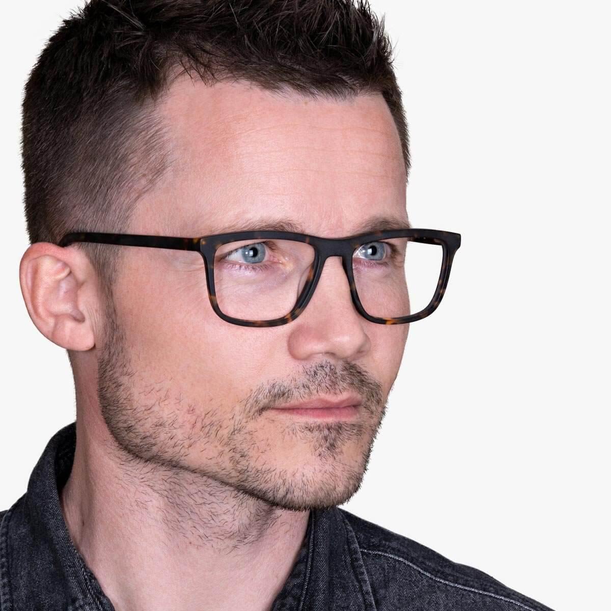 Male wearing Men's Oslo Dark Turtle glasses