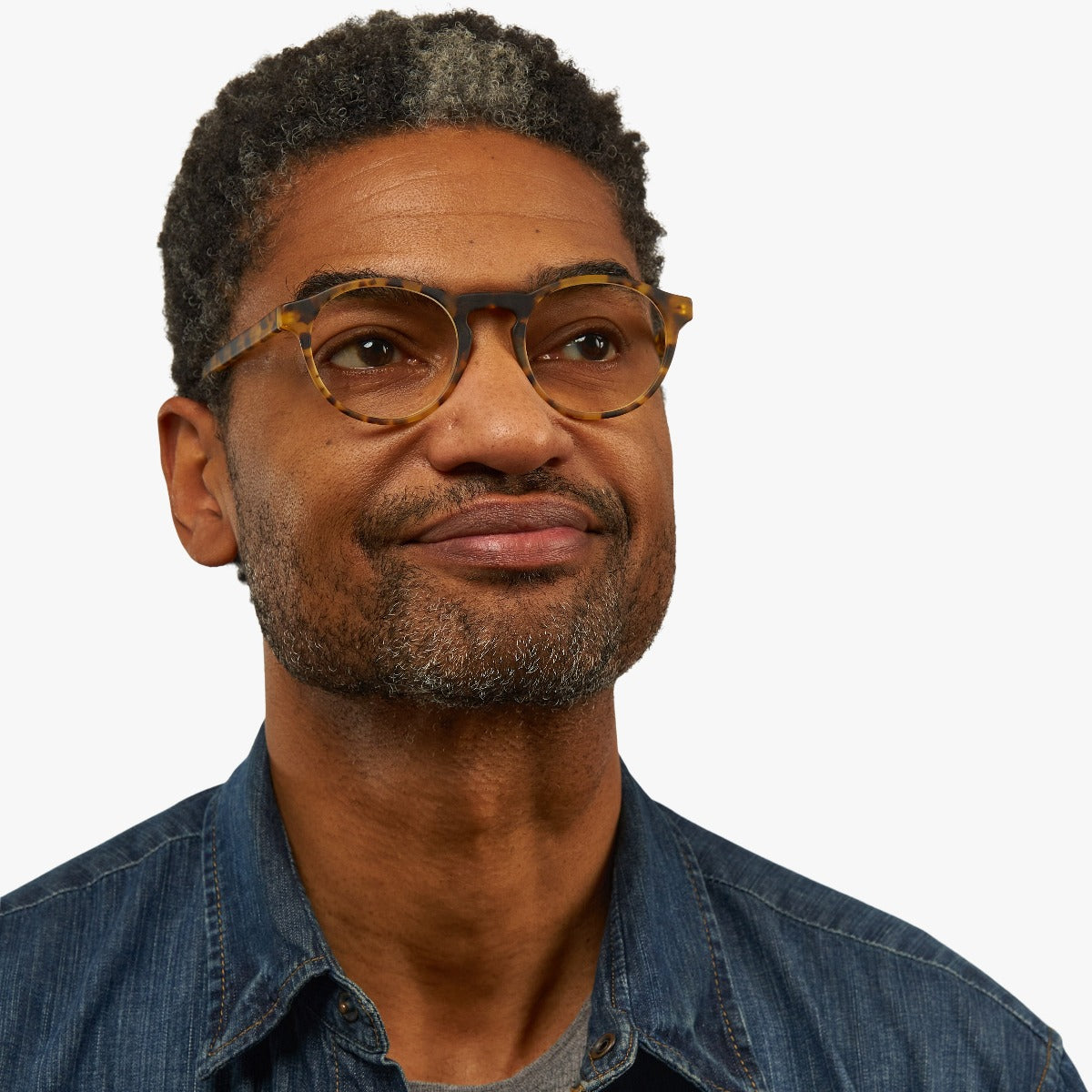 Person wearing tortoiseshell reading glasses