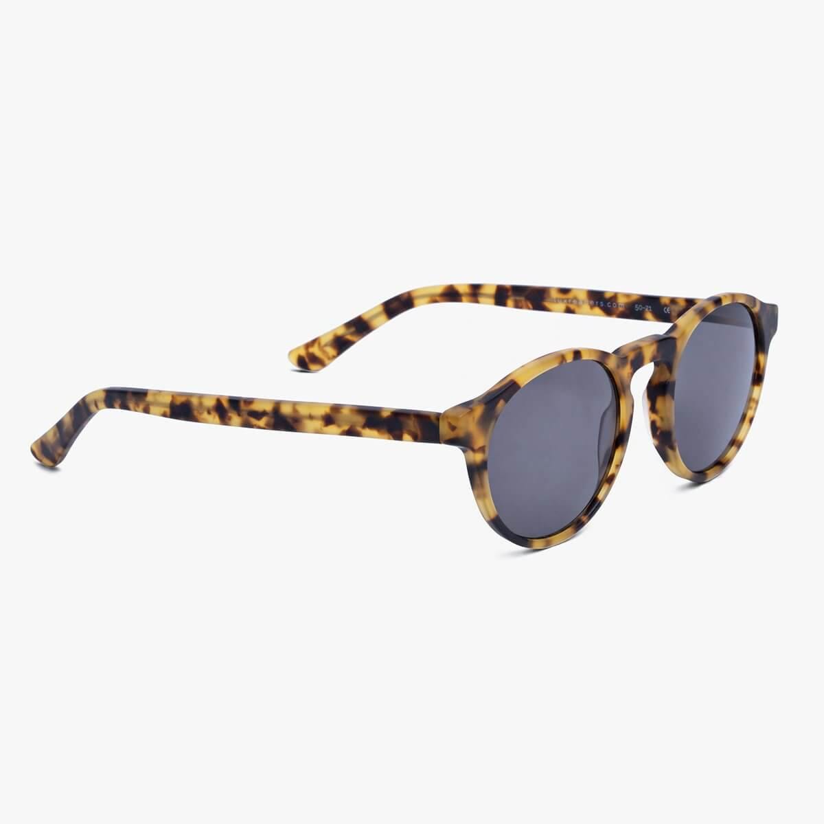 Tortoise shell sunglasses with dark lenses